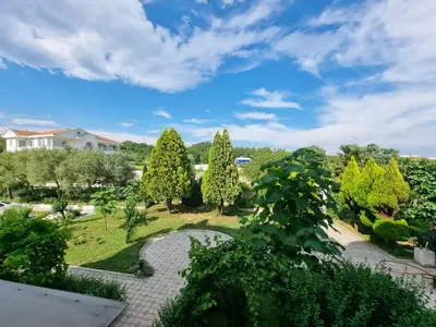 a view of a garden with trees and bushes at Le Domaine paradise