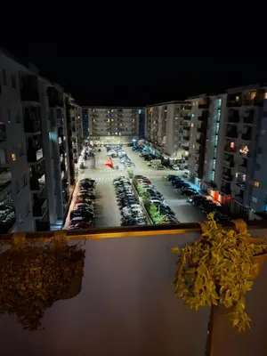 a view of a parking lot with cars parked at City kvart apartman in Podgorica