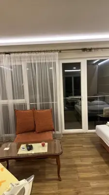 a living room with a couch and a table at Oaza mira Sutomore in Bar