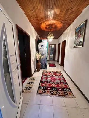 a hallway with a rug on the floor at Etno Village Revival