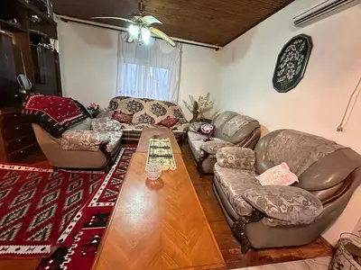 a living room with couches and a coffee table at Etno Village Revival