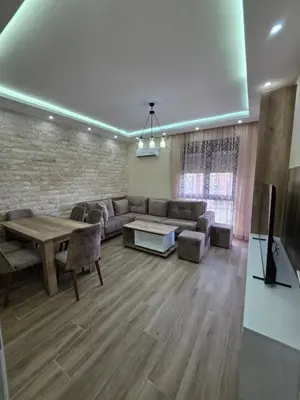 a living room with a couch and a table at S&M Stan in Ulcinj
