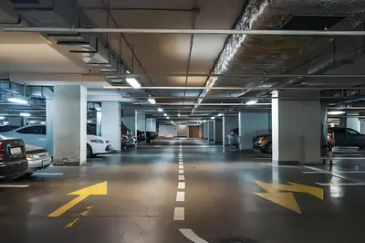an empty parking garage with cars parked in it at CL Home Lux in Podgorica
