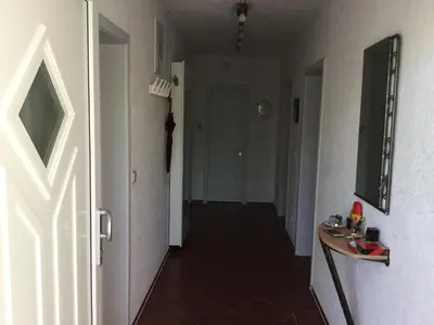 a hallway with a door leading into a room at Apartment Dorada in Dobra Voda