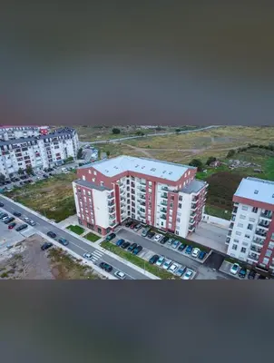 an aerial view of a city with buildings and a parking lot at Rose Stay Podgorica in Podgorica