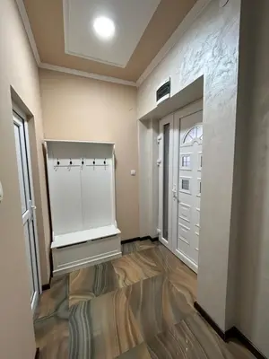 an empty room with a door and a hallway at Pause - cozy Podgorica apartment in Podgorica