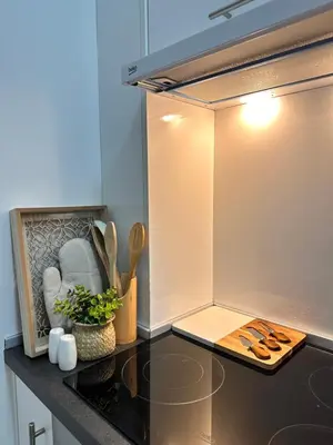 a kitchen with a counter top with a refrigerator at Azure Teuta apartment with balcony in Ulcinj