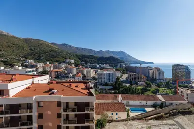 a view of the city and the ocean at Panoramic Sea View 1BD Apartment in Becici