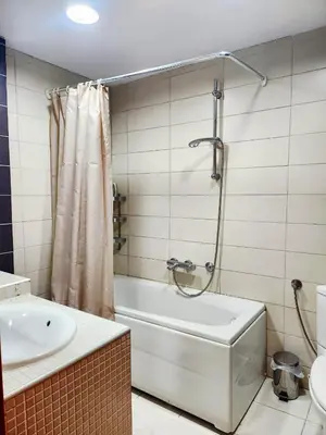 a bathroom with a shower and a tub and a sink at MWA - City Soul Podgorica in Podgorica