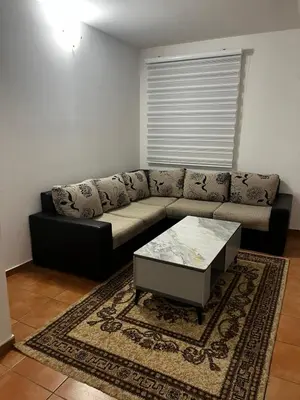 a living room with a couch and a coffee table at Kuca in Lajkovići