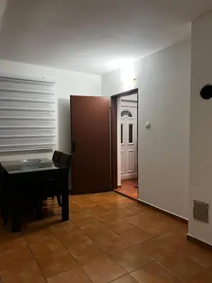 a room with a door and a table and a doorway at Kuca in Lajkovići