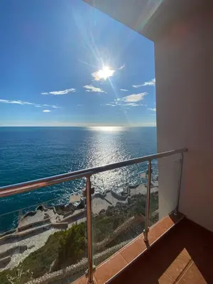 a view of the ocean from a balcony at Apartament Nadia DUBRAVA BAR in Dobra Voda