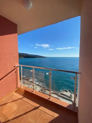 a balcony with a view of the ocean at Apartament Nadia DUBRAVA BAR in Dobra Voda