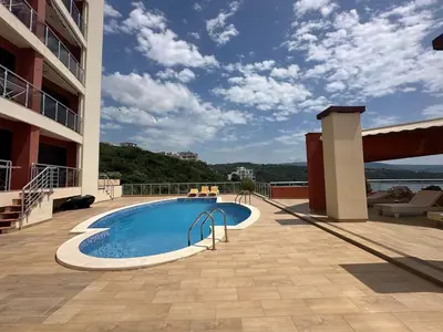 a swimming pool on top of a building at Apartament Nadia DUBRAVA BAR in Dobra Voda