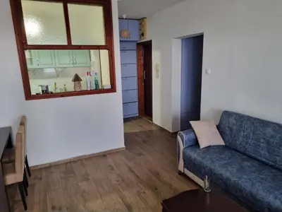 a living room with a couch and a window at Buddub in Budva