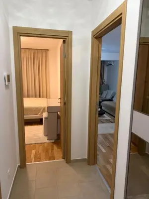 a room with a door leading to a bedroom at Aurora apartment in Cetinje