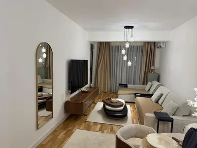 a living room with a couch and a table at Aurora apartment in Cetinje