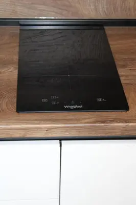 a microwave oven sitting on top of a wooden table at Luxury Apartment-Aurora 33 Free Parking City Center in Podgorica