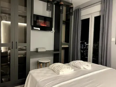 a bedroom with a bed with two white pillows on it at Dobrota Luxury House with Kotor Gulf View in Dobrota