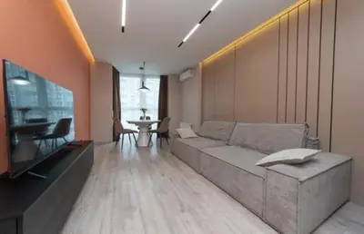 a living room with a couch and a table at Apartmani Drivasko in Sveti Stefan