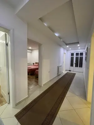 a view of a living room and dining room at Apart Sara in Ulcinj