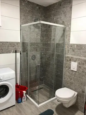 a shower stall in a bathroom with a toilet at Apart Sara in Ulcinj