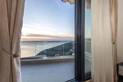 a view of a balcony with a view of the ocean at Seaview Residence in Dobra Voda