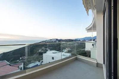 a balcony with a view of the ocean at Seaview Residence in Dobra Voda