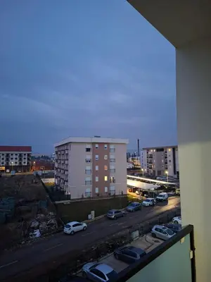 a view of a city with cars parked on a street at Apartman Asia in Podgorica