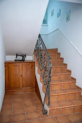 a staircase with a phone sitting on top of it at Beach House Noki 1 in Ulcinj