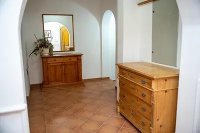 a bathroom with a wooden dresser and a mirror at Beach House Noki 1 in Ulcinj