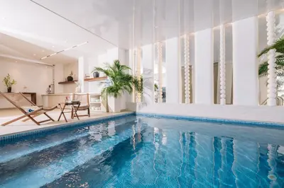 a house with a swimming pool in a room at Hotel Senator Lux in Ulcinj