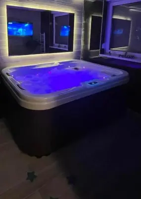 a large blue tub in a room with a window at BiO Kruce Seaview in Ulcinj