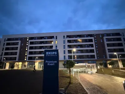 a large building with a sign in front of it at Premium Suites with GARAGE in Podgorica