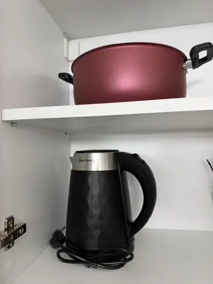 a coffee pot sitting on a shelf in a kitchen at Premium Suites with GARAGE in Podgorica
