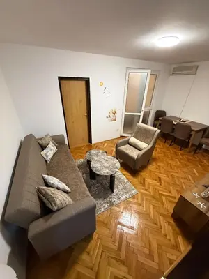 a living room with a couch and a table at Sunčana oaza, Sutomore in Sutomore