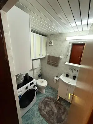 a small bathroom with a sink and a toilet at Sunčana oaza, Sutomore in Sutomore
