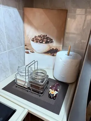 a counter with a candle and a bowl of nuts at Sunčana oaza, Sutomore in Sutomore