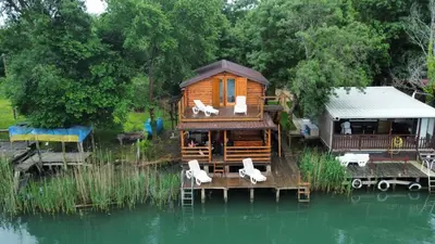 a cabin on a dock in the water at Ada Bojana River House 1 in Ulcinj