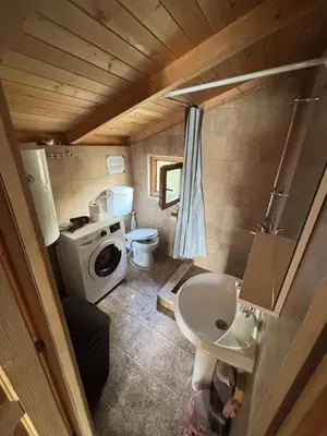 a small bathroom with a toilet and a sink at Ada Bojana River House 1 in Ulcinj