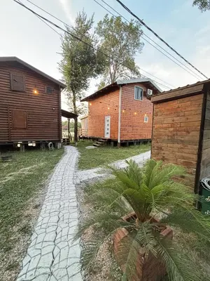 a cobblestone path between two buildings and a house at Ada Bojana River House 1 in Ulcinj