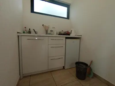 a kitchen with a sink and a window on the wall at Montebay Studio in Dobra Voda
