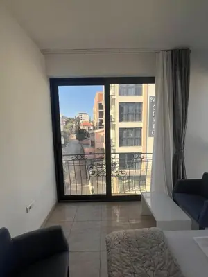 a living room with a large window with a view at Montebay Studio in Dobra Voda
