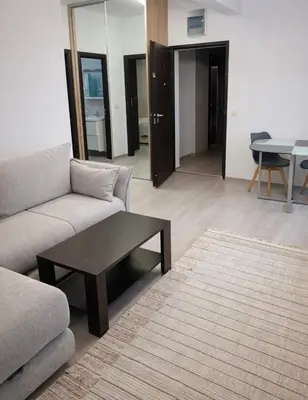 a living room with a couch and a coffee table at Modern Apartment Near the Beach - Budva in Budva