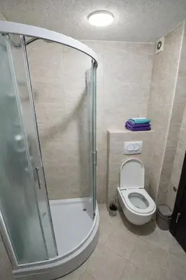 a bathroom with a shower and a toilet at Modern Apartment Near the Beach - Budva in Budva