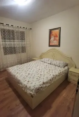 a bedroom with a bed in a room with a window at Montenegrin vintage house in Mojanovići