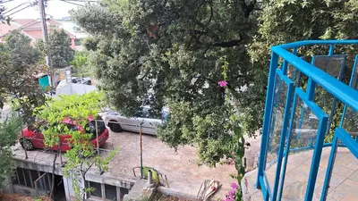 a view of a car parked in a parking lot at Apartmani Primorski hrast in Bar