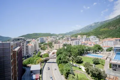 a view of a city with buildings and a road at Luxury 1-Bedroom close to the beach in Rafailovici in Rafailovici
