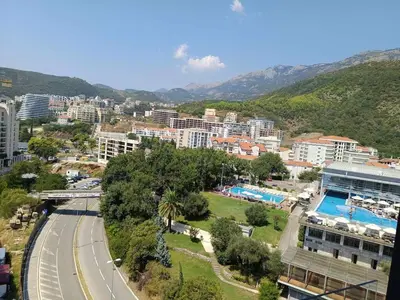 an aerial view of a city with buildings and a road at Luxury 1-Bedroom close to the beach in Rafailovici in Rafailovici