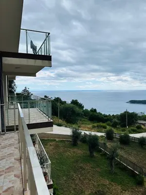 a balcony of a house with a view of the ocean at Maximus in Seoca